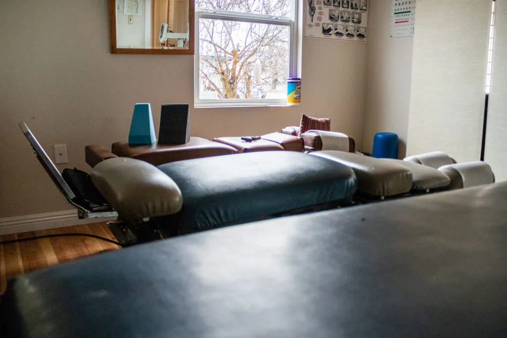 Chiropractic treatment room with decompression therapy table and equipment